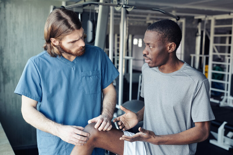 doctor and athlete talking