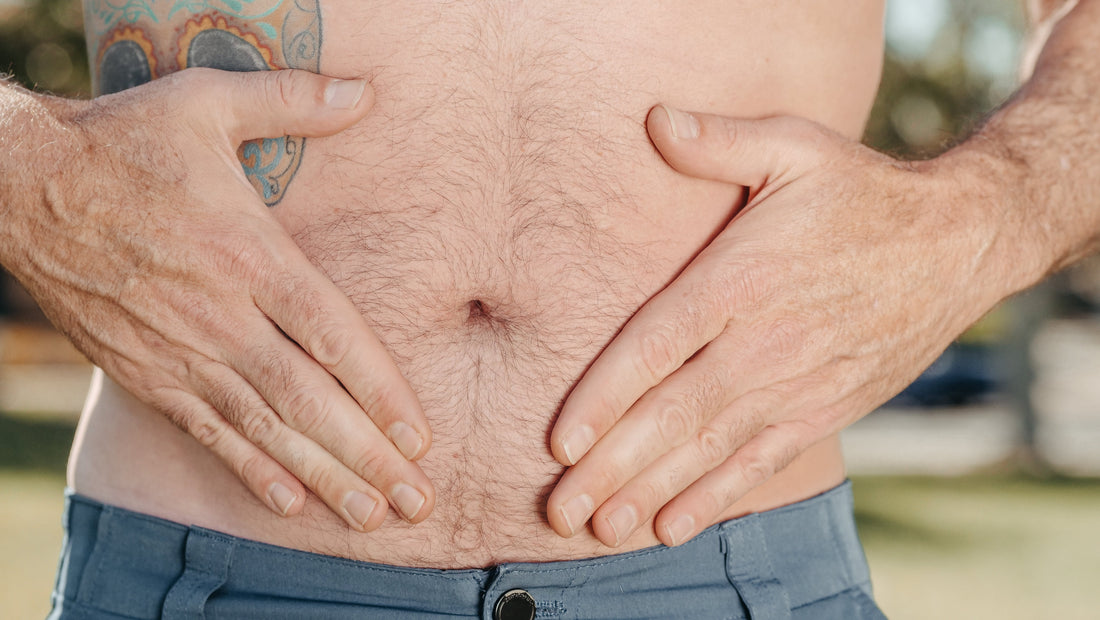 hands holding their stomach