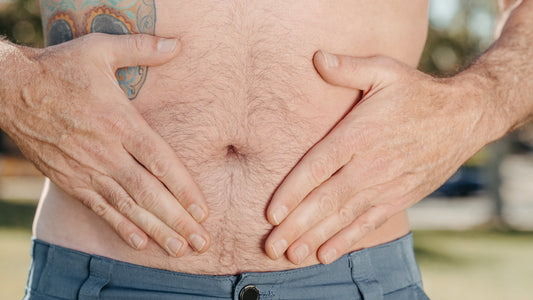 hands holding their stomach