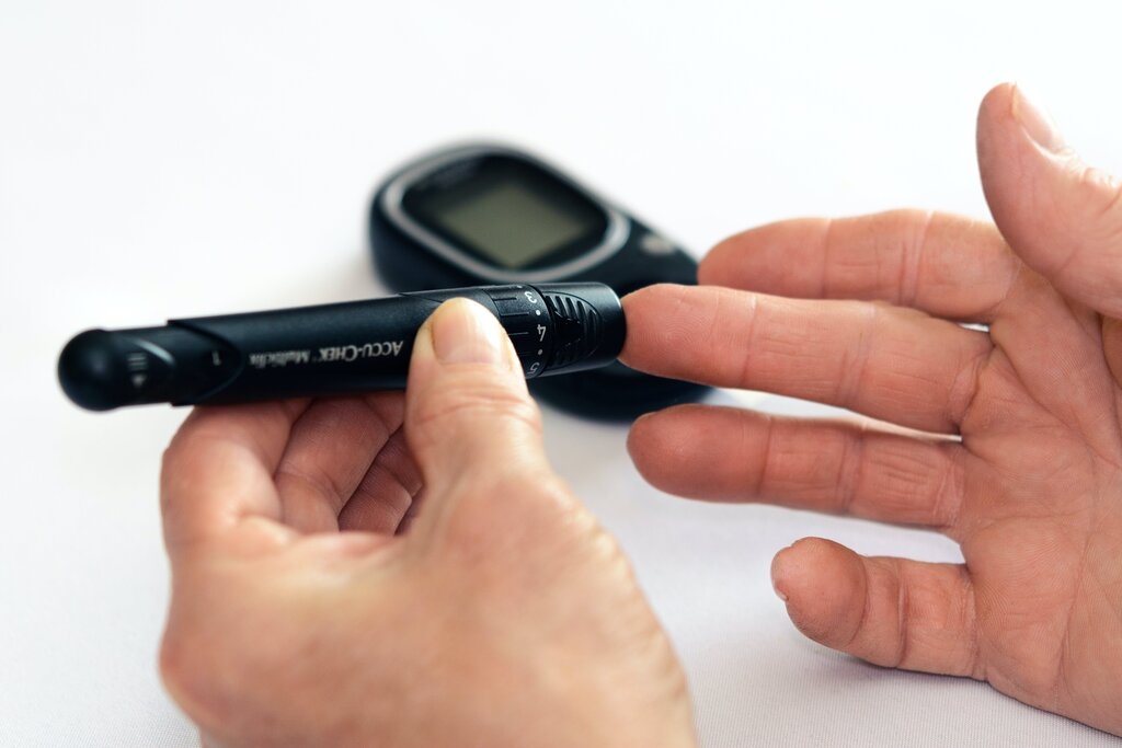 person measuring their blood sugar